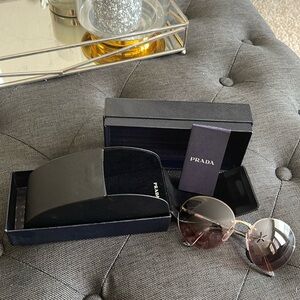 Prada rimless  rose colored round sunglasses